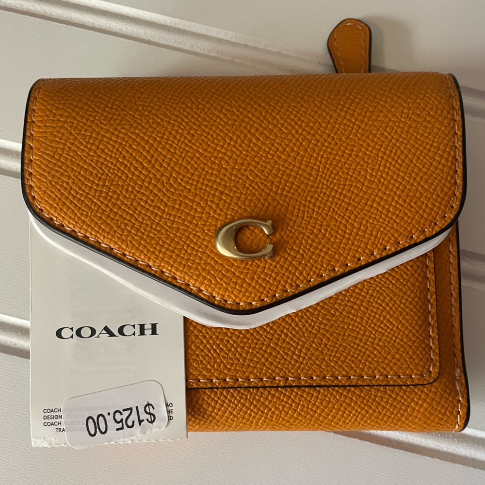 NWT Coach yellow leather wallet. Purchased @Dillards brand new.